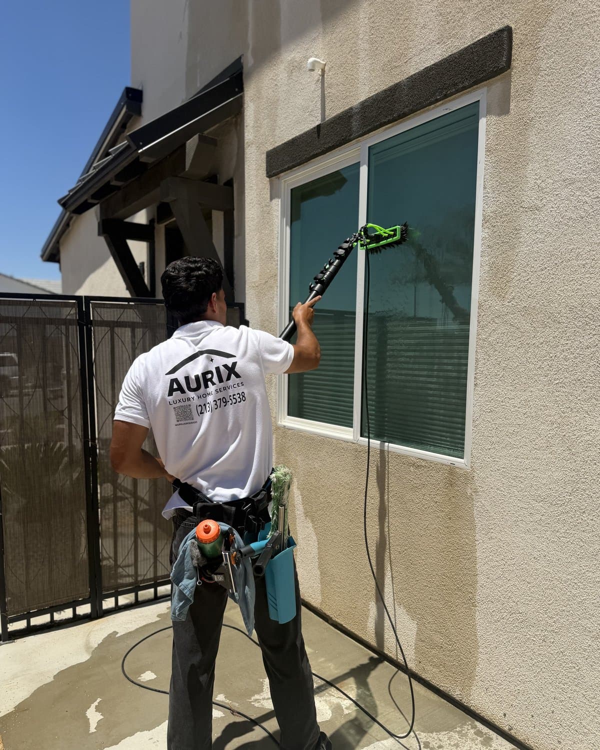 Exterior glass being cleaned with a professional squeegee